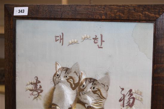 An early 20th century Japanese silkwork panel of two kittens, mounted as an oak firescreen, panel 40 x 43cm